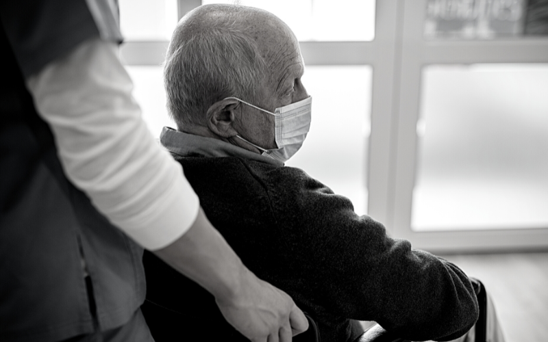 elderly man in wheelchair in a nursing home