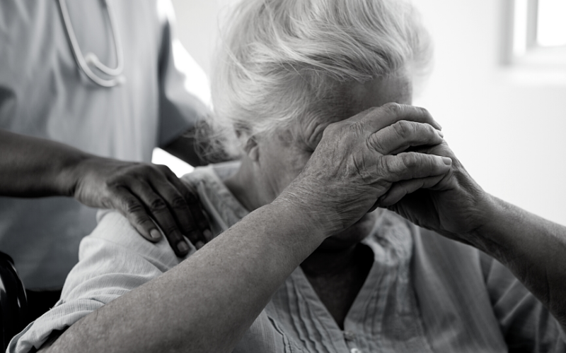 Woman in wheelchair sad